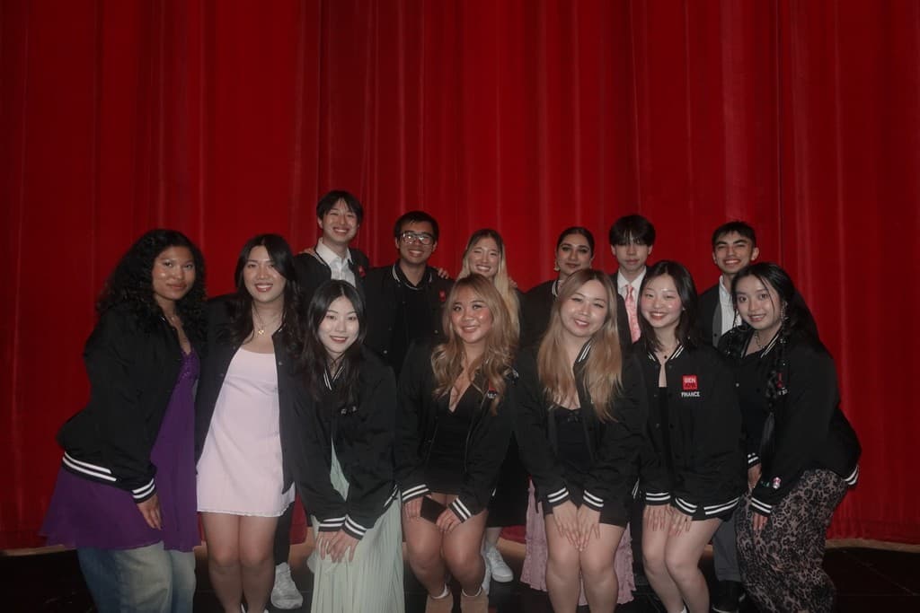 The GenAPA core board on stage in front of a red curtain after the culture show.